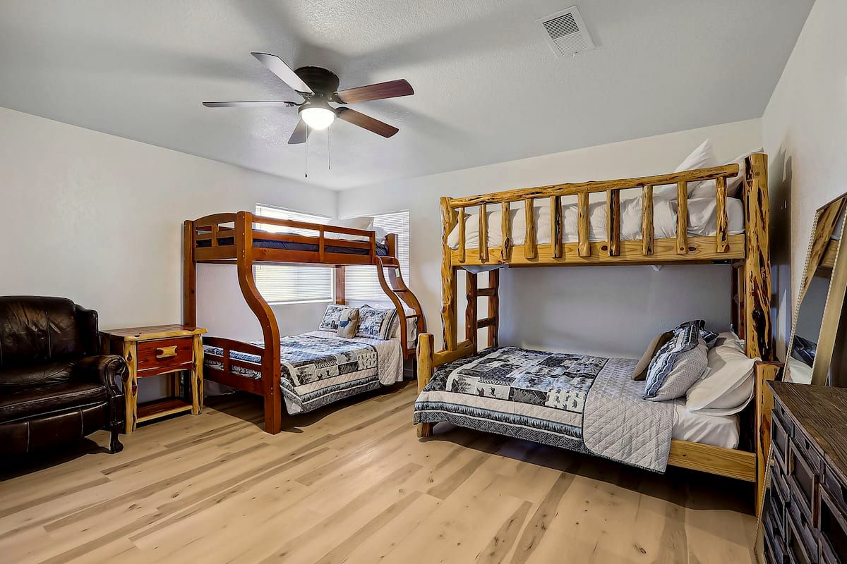 Bunk room with two twin-over-full log bunk beds