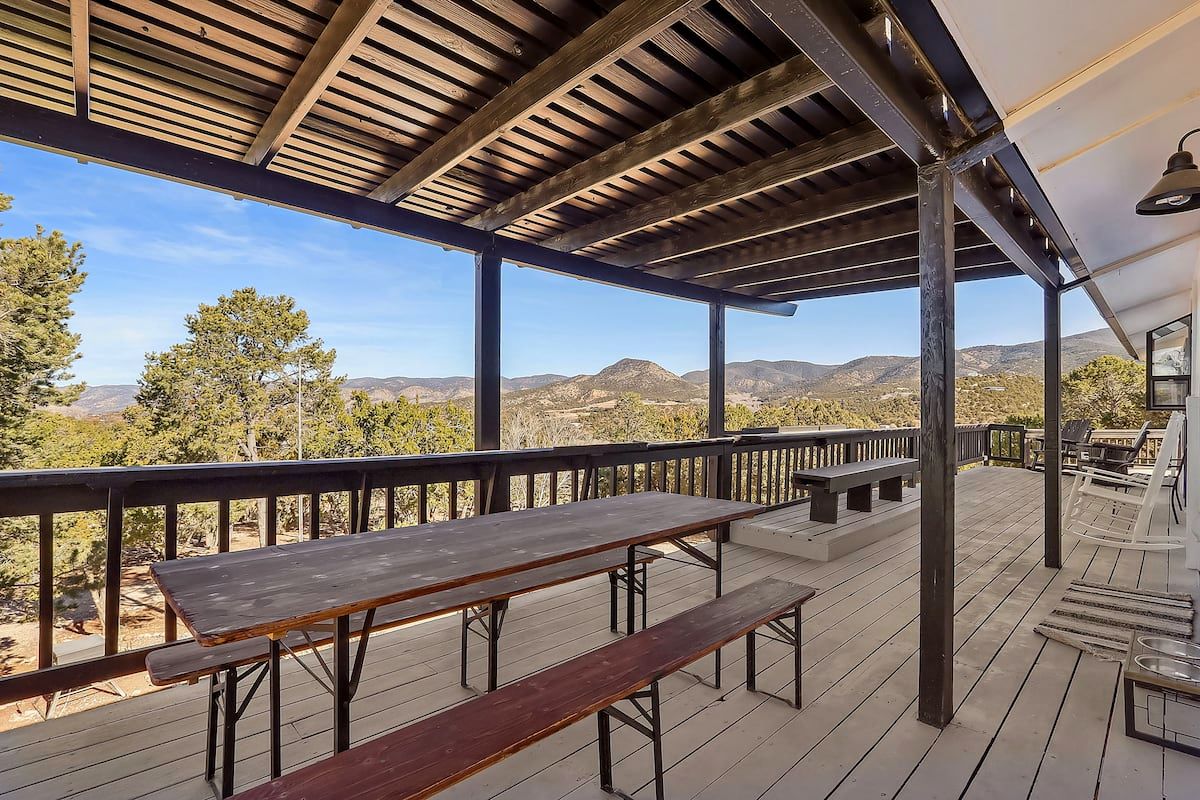 Long outdoor dining table on the covered deck