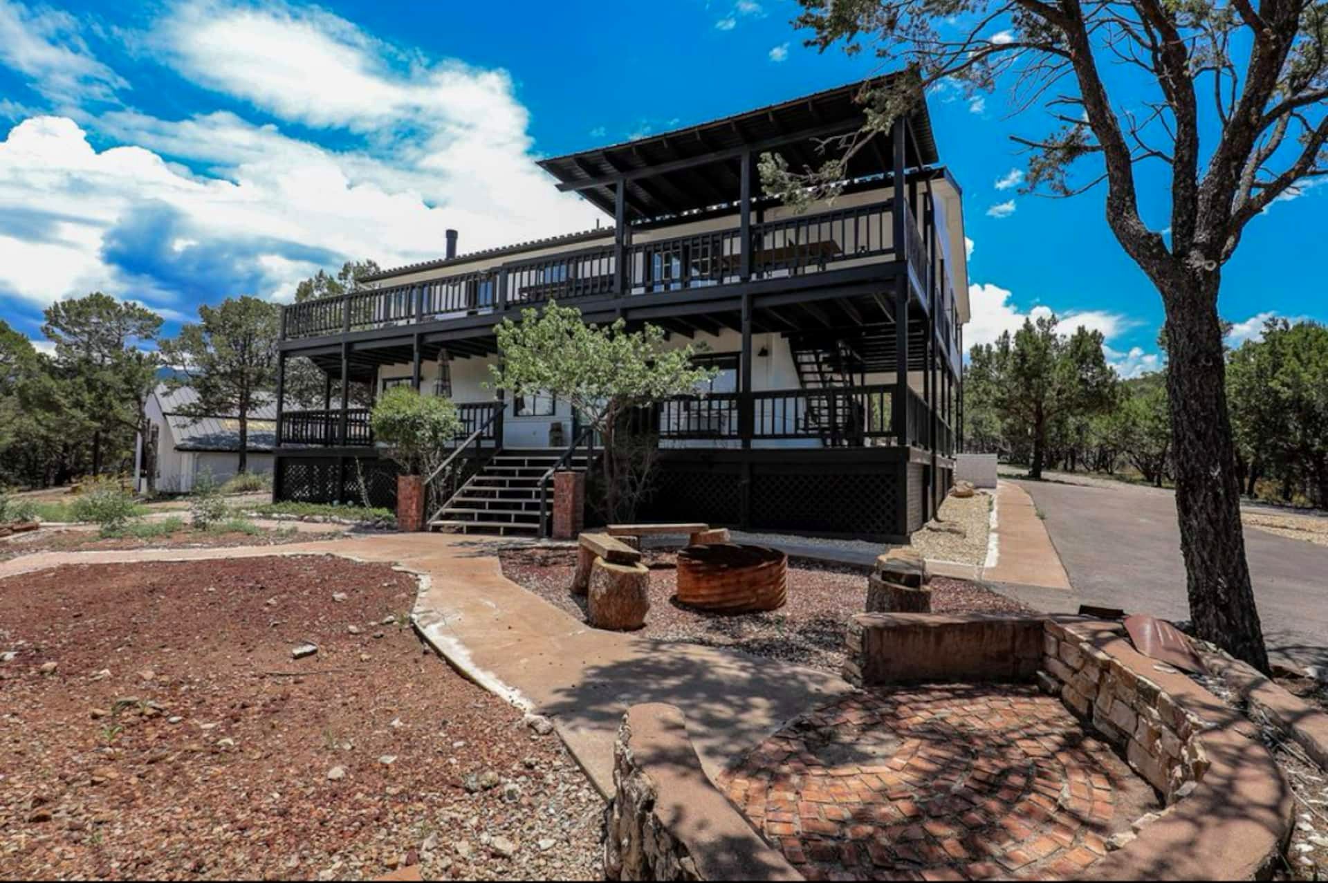 White Wolf Lodge, a two-story cabin rental with wraparound decks in High Rolls near Cloudcroft, NM