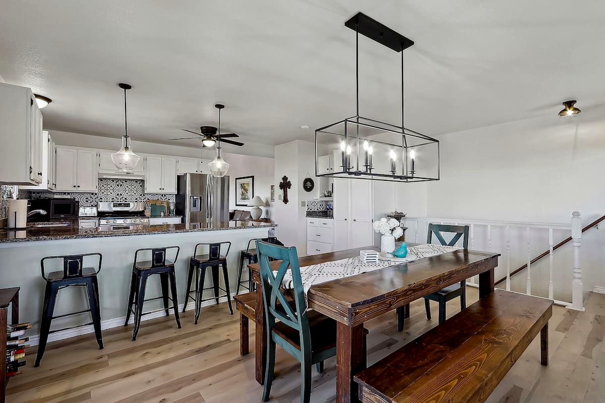 Open kitchen with island seating and farmhouse dining table