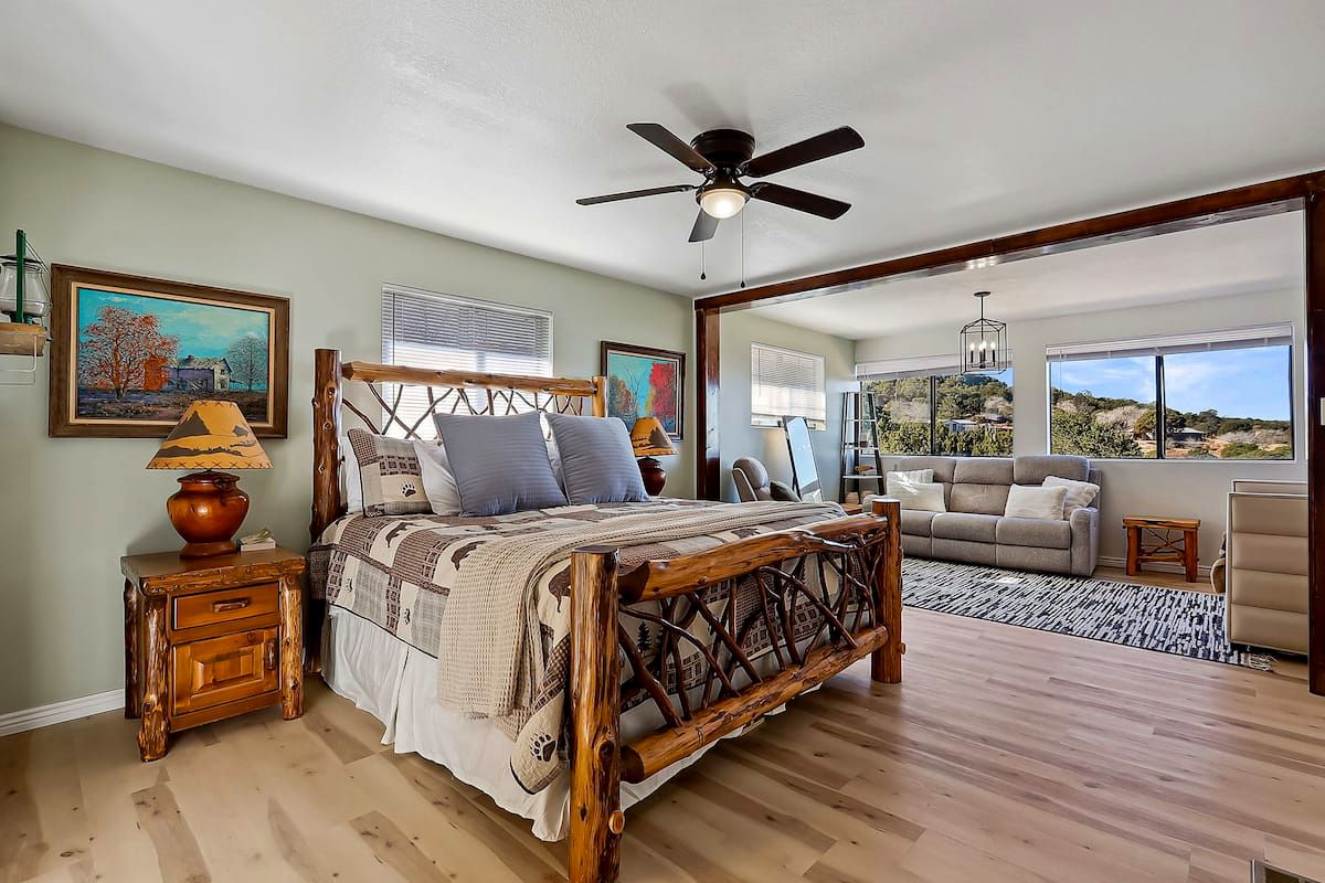 Primary suite with rustic log king bed